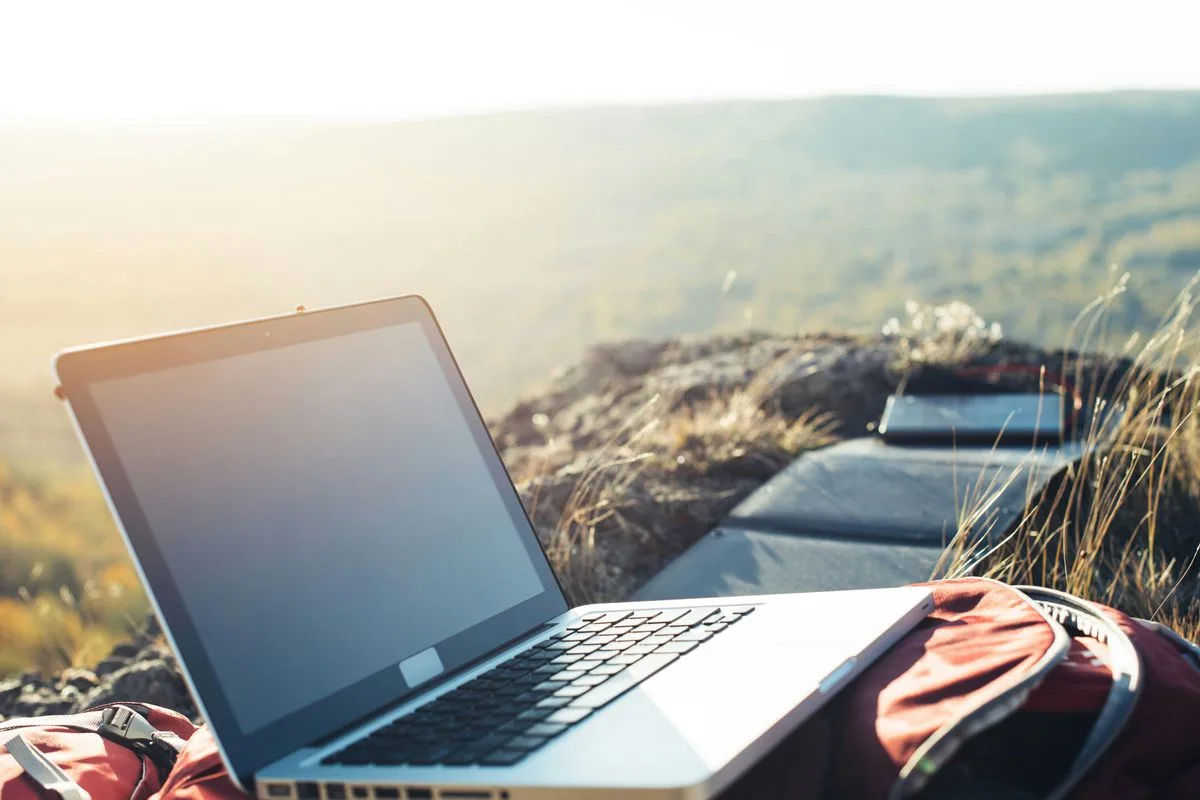 MacBook Air on a person's lap, representing the college search journey that inspired CollegeCove